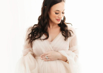 Woman in maternity gown during photo session in Houston Texas