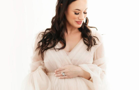 Woman in maternity gown during photo session in Houston Texas
